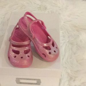 One pair of pink crocs